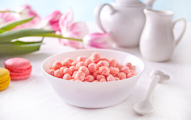 bowl with strawberry sweet corn balls. Delicious and healthy breakfast cereal.