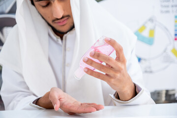 Fototapeta na wymiar Arab architect cleaning his hands before starting his work
