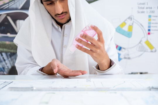 Arab architect cleaning his hands before starting his work