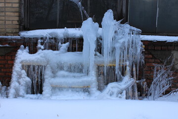 A thick layer of ice and icicles. Moscow. Russia.