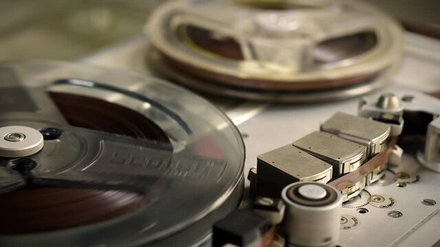 Old vintage reel-to-reel player. Tape recorder with spools. Bobbin tape recorder.	
