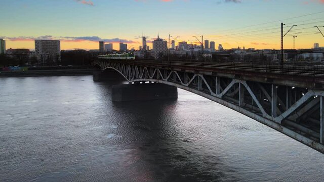 Panoramic drone view over transportation bridge in Warsaw during sunset in winter time