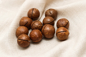Healthy, organic inshell macadamia nuts. An expensive nut for the keto diet.