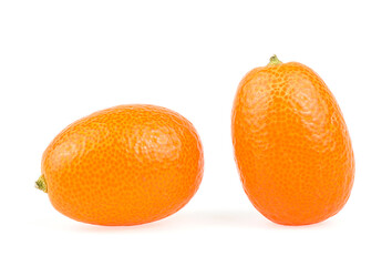 Two fresh kumquat fruits isolated on a white background