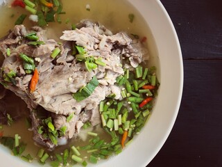 Giant dish of Thai style food. Hot and Spicy Soup with Pork Ribs. Spicy Pork with Pork bone Soup (Lang Zaap). Is a spicy and popular food in Thailand Tourists like it very much.