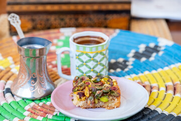 Arabic sweets, maamoul and coffee on traditional background