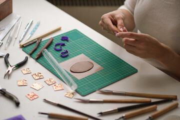 Craft jewelery making with professional tools. A handmade jeweler process, manufacture of jewellery.