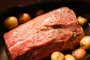 Pot roast dinner with vegetables in the crockpot