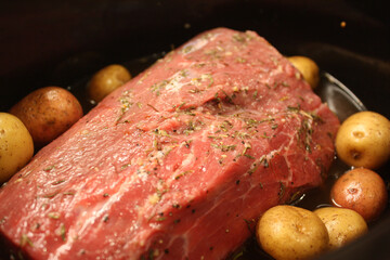 Pot roast dinner with vegetables in the crockpot
