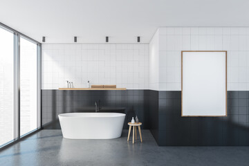 Fototapeta na wymiar Mockup frame in white and black bathroom with bathtub near window