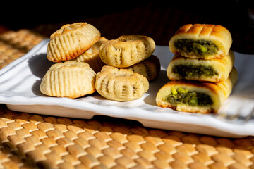 Arabic sweets, maamoul and coffee on traditional background