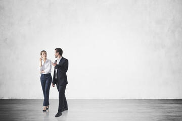 Handsome businessman and attractive businesswoman in formal wear