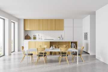 White kitchen set with eating table and chairs, window and marble floor