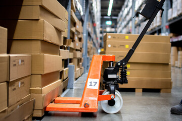 A brown box on a pallet truck in the warehouse