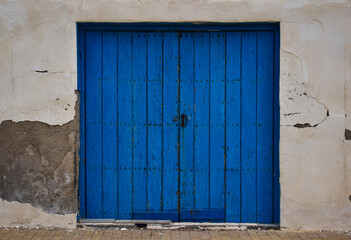 facade with old blue wooden door