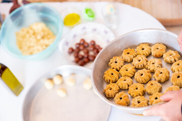 Arabic woman hands making eid sweets ,cookiesand mamoul