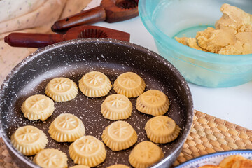 Arabic woman hands making eid sweets ,cookiesand mamoul