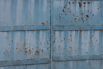 blue gray metal texture from old rusty wall with shabby paint and seams