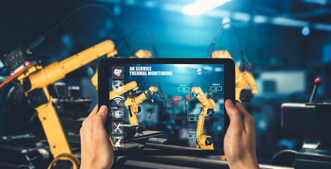 Engineer controls robotic arms by augmented reality industry technology application software. Smart...