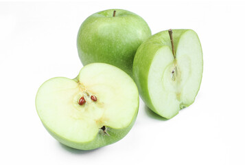 Two halfs and one whole green apple isolated on white background. Sliced fruit