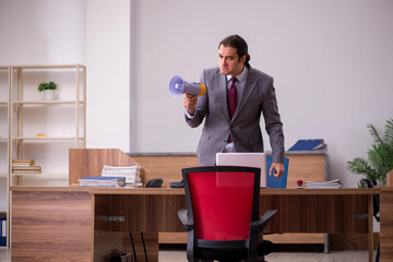 Young businessman employee in bullying concept in the office