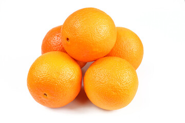 Pile of oranges isolated on white background. Delicious fruit