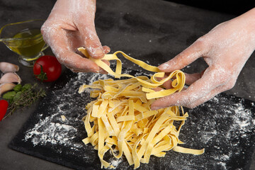 Italian pasta cooking process. Fresh food concept. Home made tagliatelle
