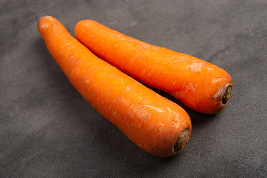 Fresh organic carrot on grey background. Vegetables. Healthy food