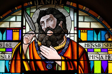 Stained glass window.  Daniel is the hero of the biblical Book of Daniel. Taninges. France....