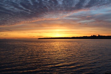 Sunset at the bay with a silhouette of White Rock, Canada