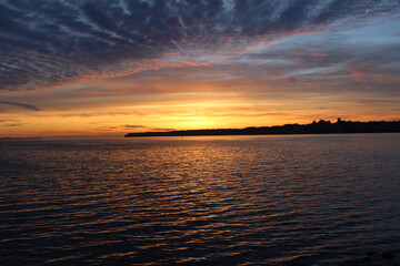 Sunset at the bay with a silhouette of White Rock, Canada