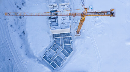 Snowy abandoned empty construction site, top view