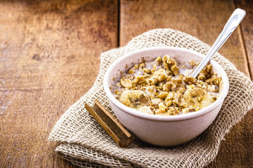 Recycled bowl with vegan dessert, made of quinoa, fruits and cinnamon, with copy space