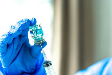Medical concept ampoules or vials with Covid-19 vaccine on a laboratory bench