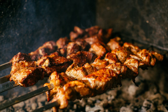 shish kebab on skewers is prepared on the grill