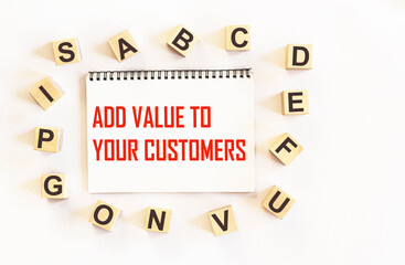 Notepad with text ADD VALUE TO YOUR CUSTOMERS . business concept