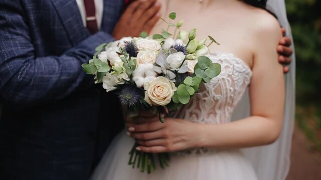 A black guy gently puts his arm around the shoulders of his white girlfriend. A very beautiful couple. Close-up shooting