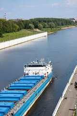 cargo ship ready to enter the lock on Volga river in Russia
