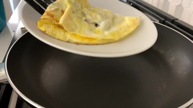 Cooking a Mushroom  Omelet in a Kitchen