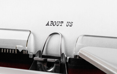 Text ABOUT US typed on retro typewriter