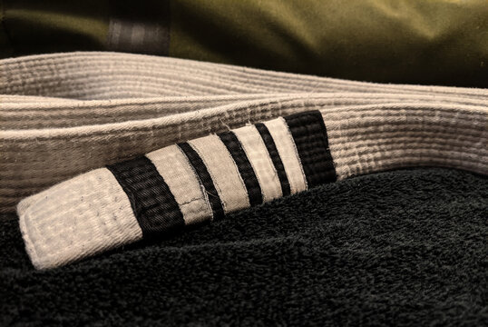 White Belt Close-up With Black and Green