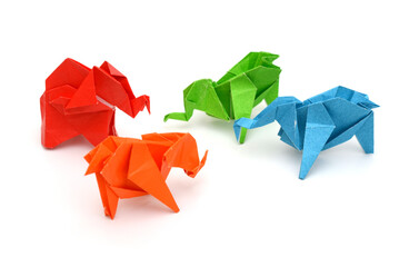 Colorful origami elephants on white