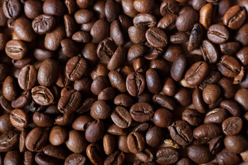Roasted coffee beans close up. Coffee grains background. 