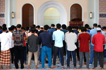 Naklejka premium Al-Serkal Mosque. Muslim men praying for friday prayer. Phnom Penh. Cambodia. 23.11.2018