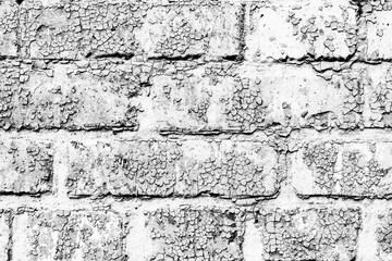 Texture of a brick wall with cracks and scratches which can be used as a background