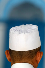 Muslim at the friday prayer (salat).  Kufi hat.  21.09.2018