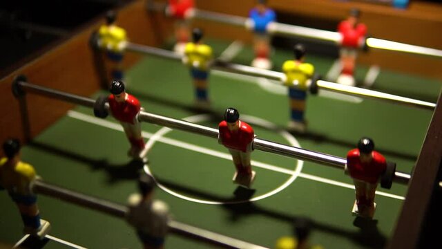 football on the table at night the light blinks football soccer competition, ball detail face. taca futbol table soccer miniature
