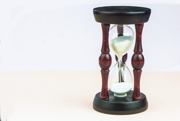 hourglass stands on a colored background
