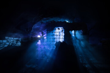 Old ruined stone house in deserted garden at night. Selective focus