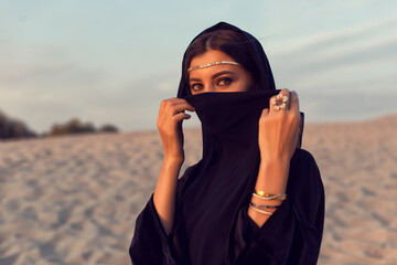 Muslim girl in the summer desert